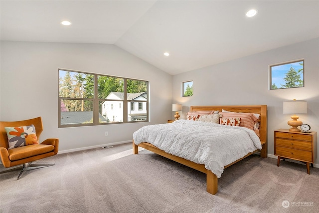 carpeted bedroom featuring vaulted ceiling