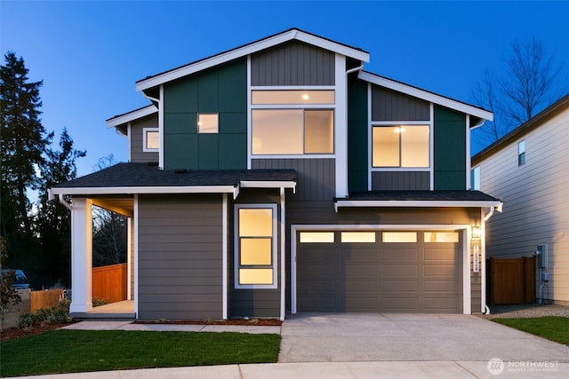 contemporary home featuring concrete driveway, an attached garage, fence, and roof with shingles