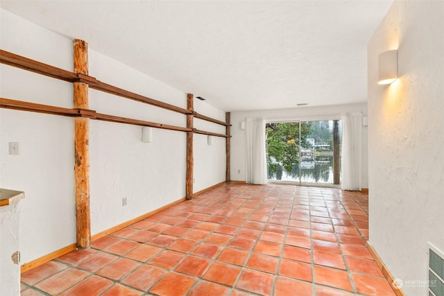 spare room featuring a textured ceiling