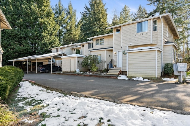 front facade with a carport