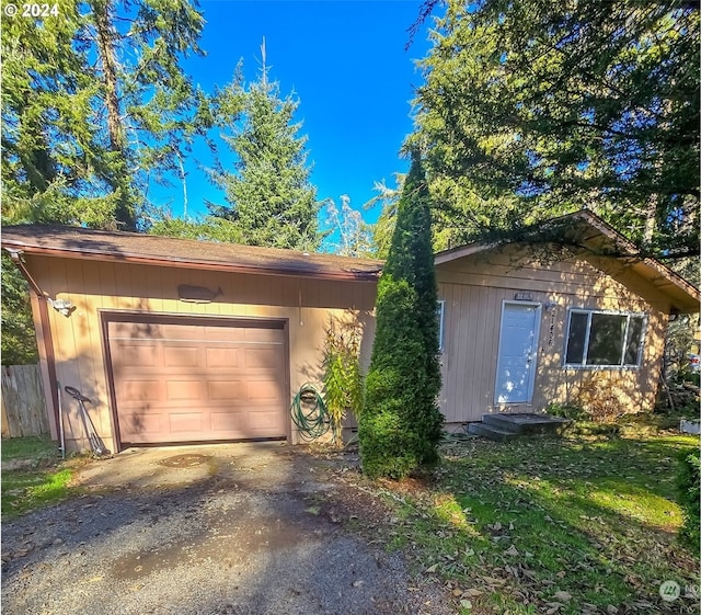 single story home featuring a garage