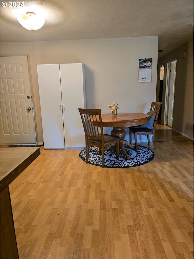 dining space featuring light wood-type flooring