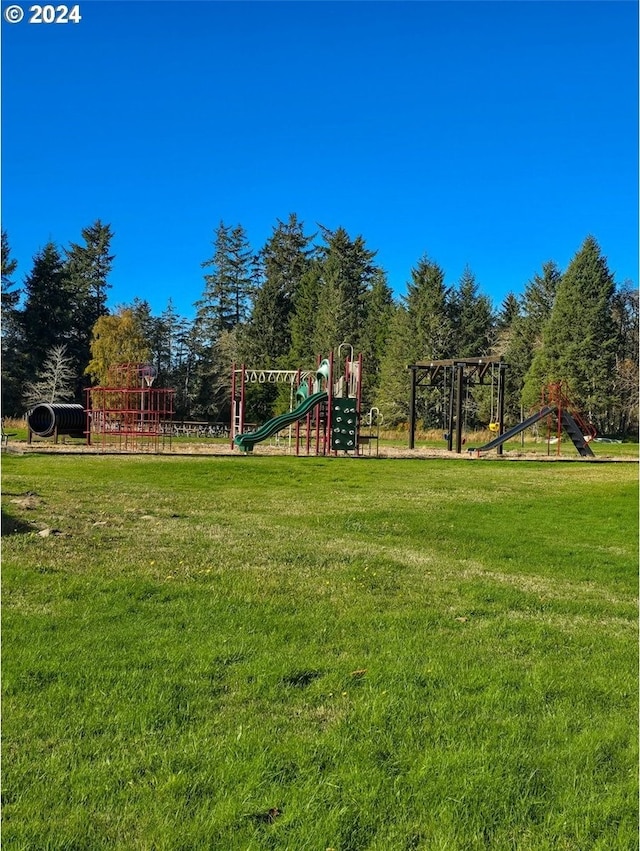 view of jungle gym with a lawn