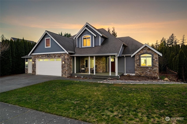 view of front of property with a porch and a yard