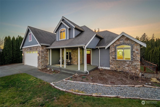 view of front facade with a garage and a porch