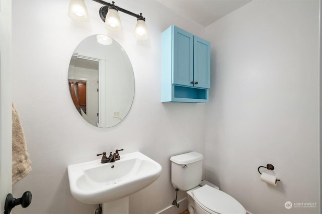 bathroom with sink and toilet