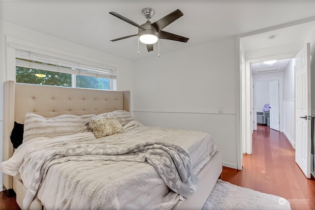 bedroom featuring dark hardwood / wood-style floors and ceiling fan