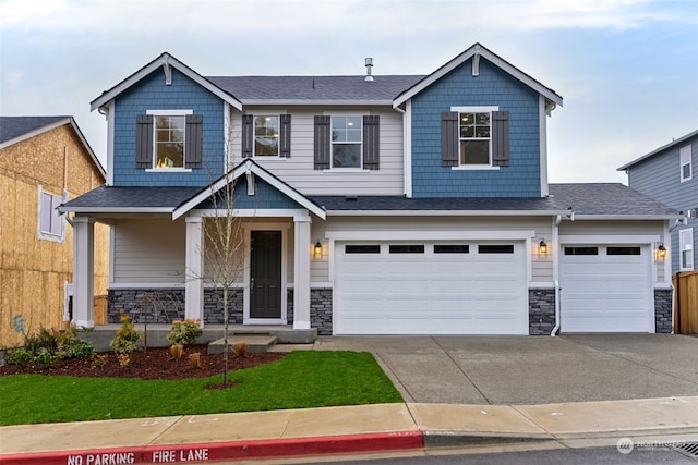 craftsman-style home featuring a garage and covered porch