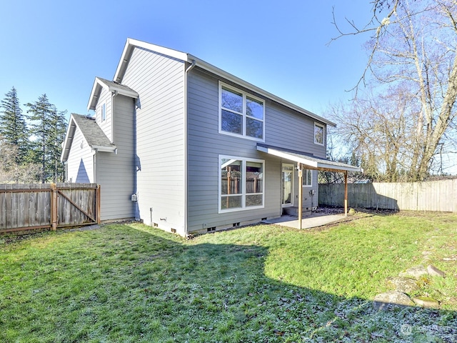 back of property featuring a yard and a patio area