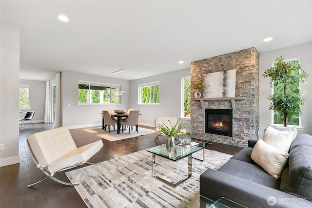 living room featuring recessed lighting, wood finished floors, and baseboards