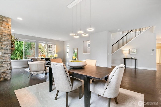 dining space with stairs, recessed lighting, wood finished floors, and baseboards