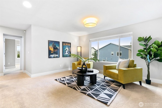 living area with carpet flooring and baseboards