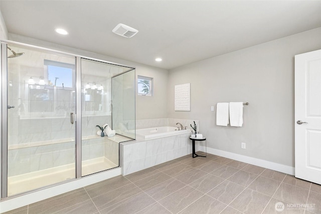 bathroom with a garden tub, visible vents, baseboards, tile patterned floors, and a stall shower