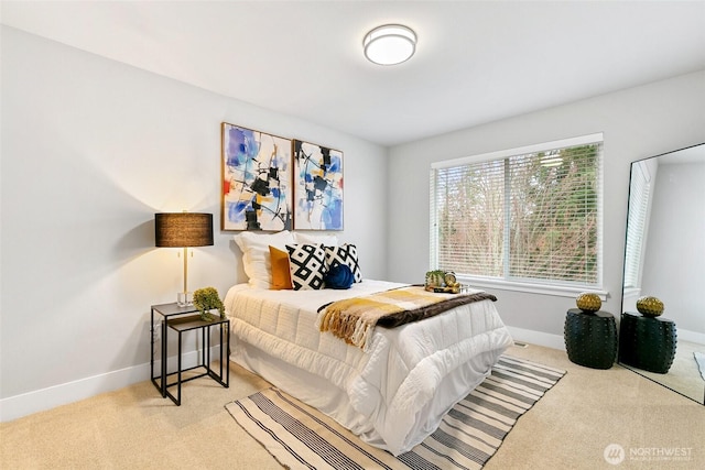 carpeted bedroom with baseboards