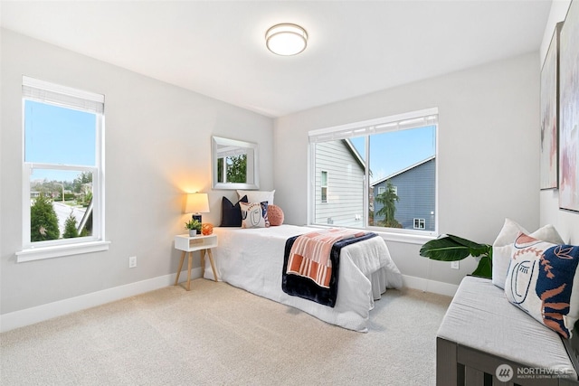 bedroom featuring carpet flooring and baseboards