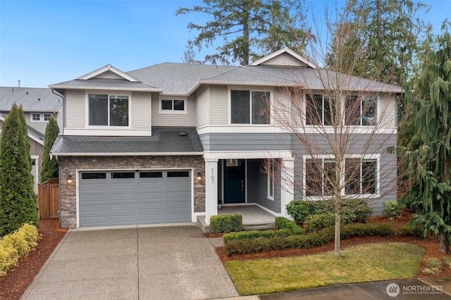 view of front of home featuring a garage, stone siding, driveway, and roof with shingles