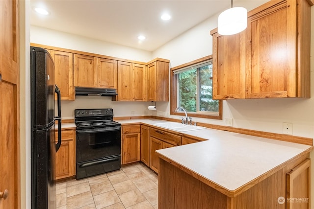 kitchen featuring sink, light tile patterned floors, black appliances, decorative light fixtures, and kitchen peninsula