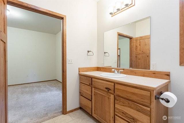 bathroom with tile patterned flooring and vanity