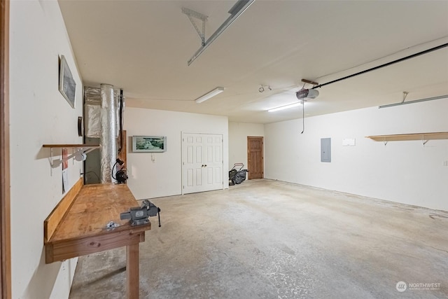 garage featuring a garage door opener and electric panel