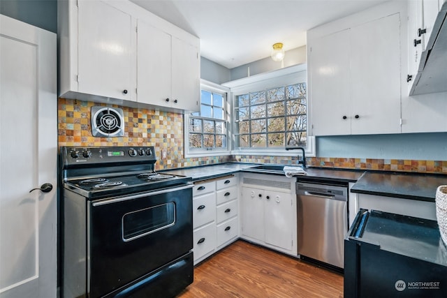 kitchen with sink, stainless steel dishwasher, white cabinets, and black range with electric cooktop