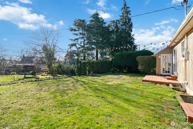 view of yard featuring a wooden deck