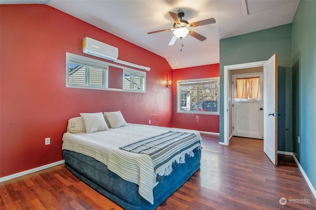 bedroom featuring vaulted ceiling, dark hardwood / wood-style flooring, ceiling fan, and a wall unit AC