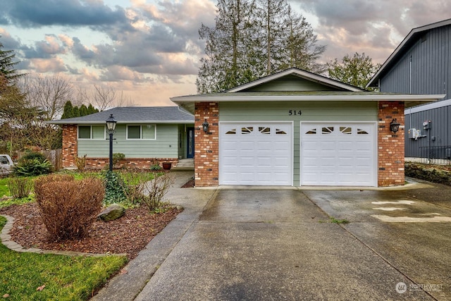 single story home with a garage