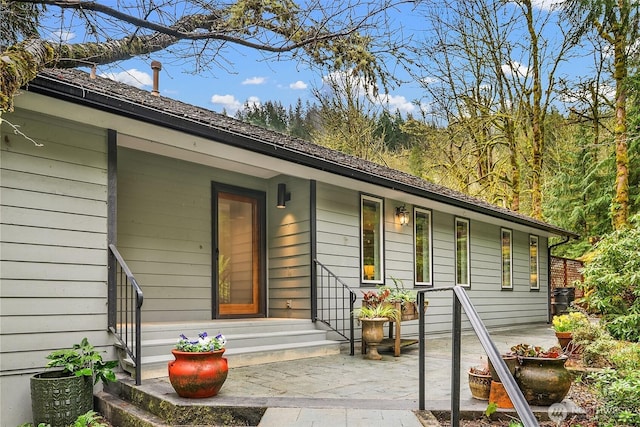 doorway to property with a patio area