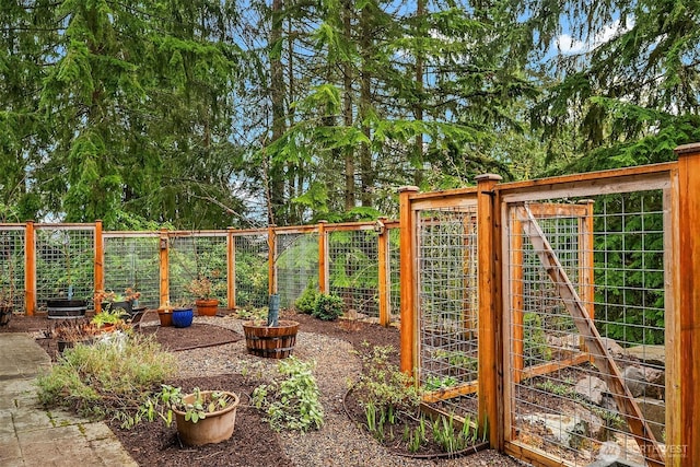 view of yard featuring a garden and fence