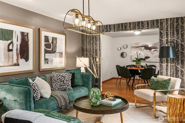 living room featuring an inviting chandelier and wood finished floors