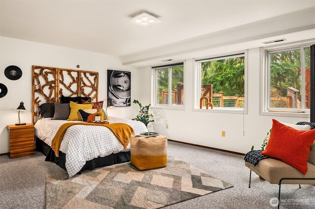 bedroom with carpet flooring and baseboards