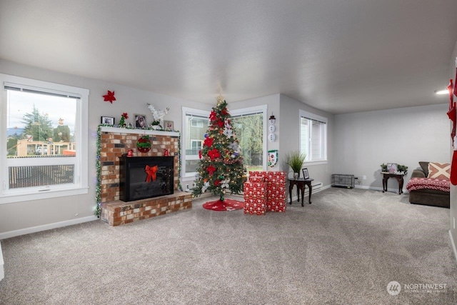 living room with a fireplace and carpet