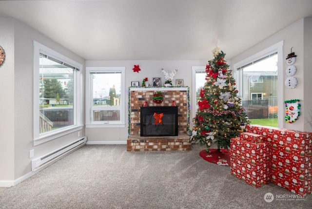 living room featuring a fireplace, a baseboard radiator, and carpet flooring