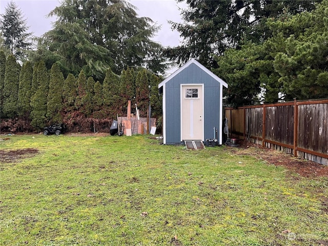 view of shed with fence private yard