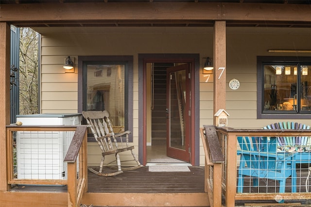 entrance to property featuring a porch