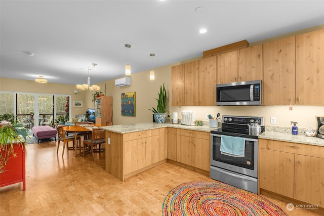 kitchen featuring light brown cabinetry, a wall mounted air conditioner, decorative light fixtures, appliances with stainless steel finishes, and kitchen peninsula