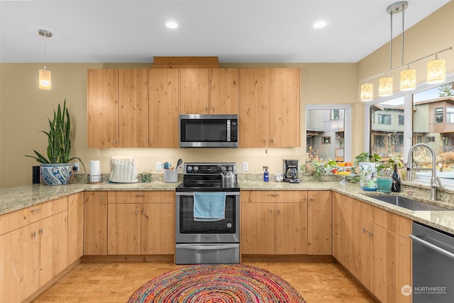 kitchen with appliances with stainless steel finishes, decorative light fixtures, sink, light stone counters, and light brown cabinets