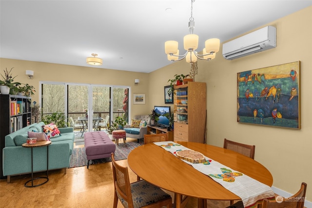 dining space featuring wood-type flooring, a wall mounted AC, and a chandelier