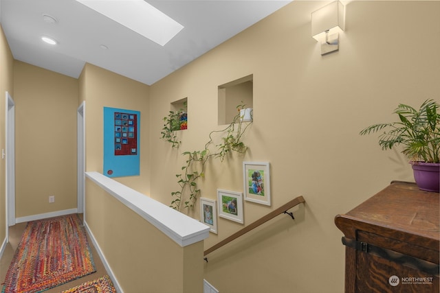 hallway featuring a skylight