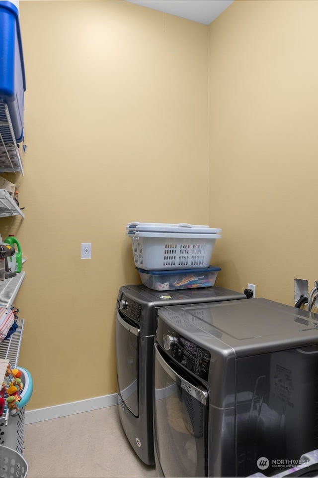 laundry area featuring washing machine and clothes dryer