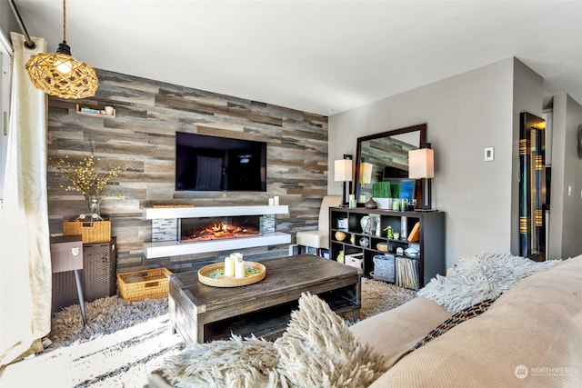 living room featuring a tiled fireplace