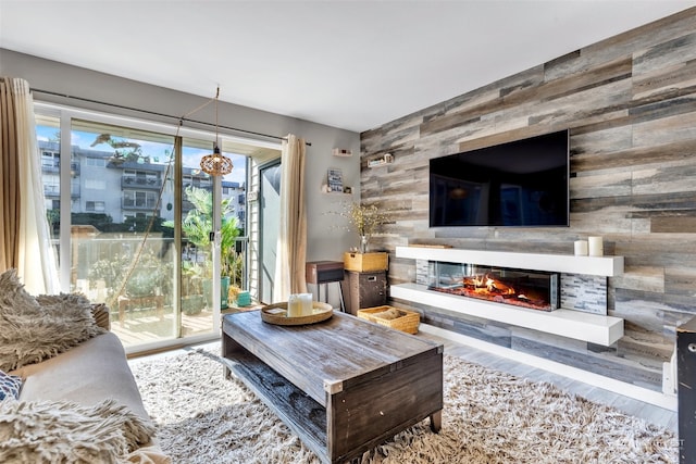 living room featuring hardwood / wood-style flooring and wood walls