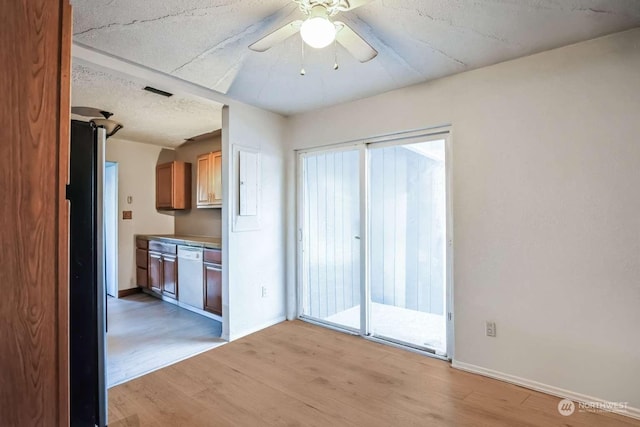 kitchen featuring ceiling fan, light hardwood / wood-style flooring, stainless steel refrigerator, and dishwasher