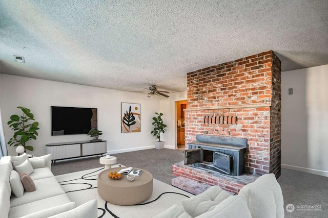 carpeted living room with a textured ceiling, ceiling fan, and a wood stove