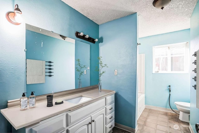 full bathroom featuring toilet, a textured ceiling, shower / tub combination, vanity, and tile patterned flooring