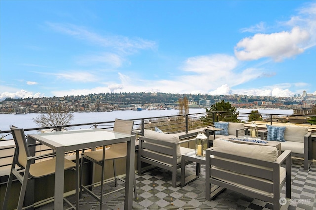 view of patio / terrace with an outdoor living space with a fire pit