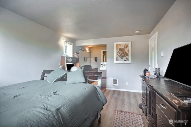 bedroom featuring light hardwood / wood-style flooring