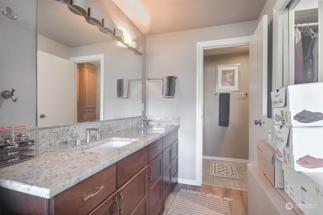 bathroom featuring vanity and hardwood / wood-style floors