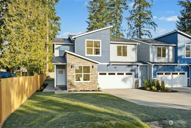 view of front facade with a garage and a front lawn