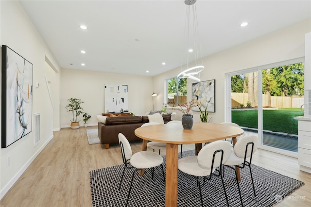 dining area with light hardwood / wood-style flooring